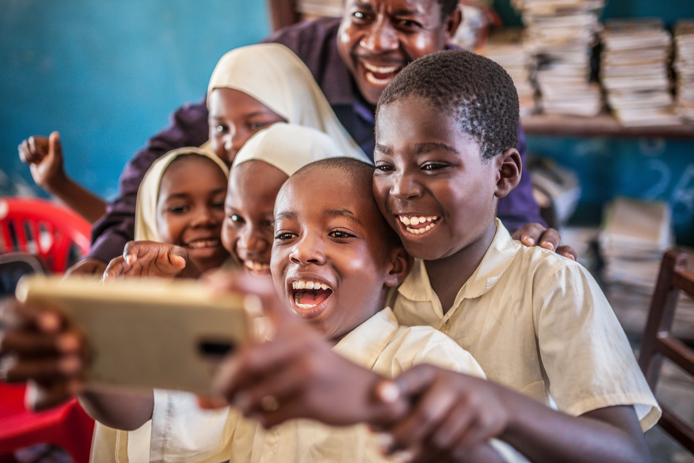 african child  taking selfie in classroom